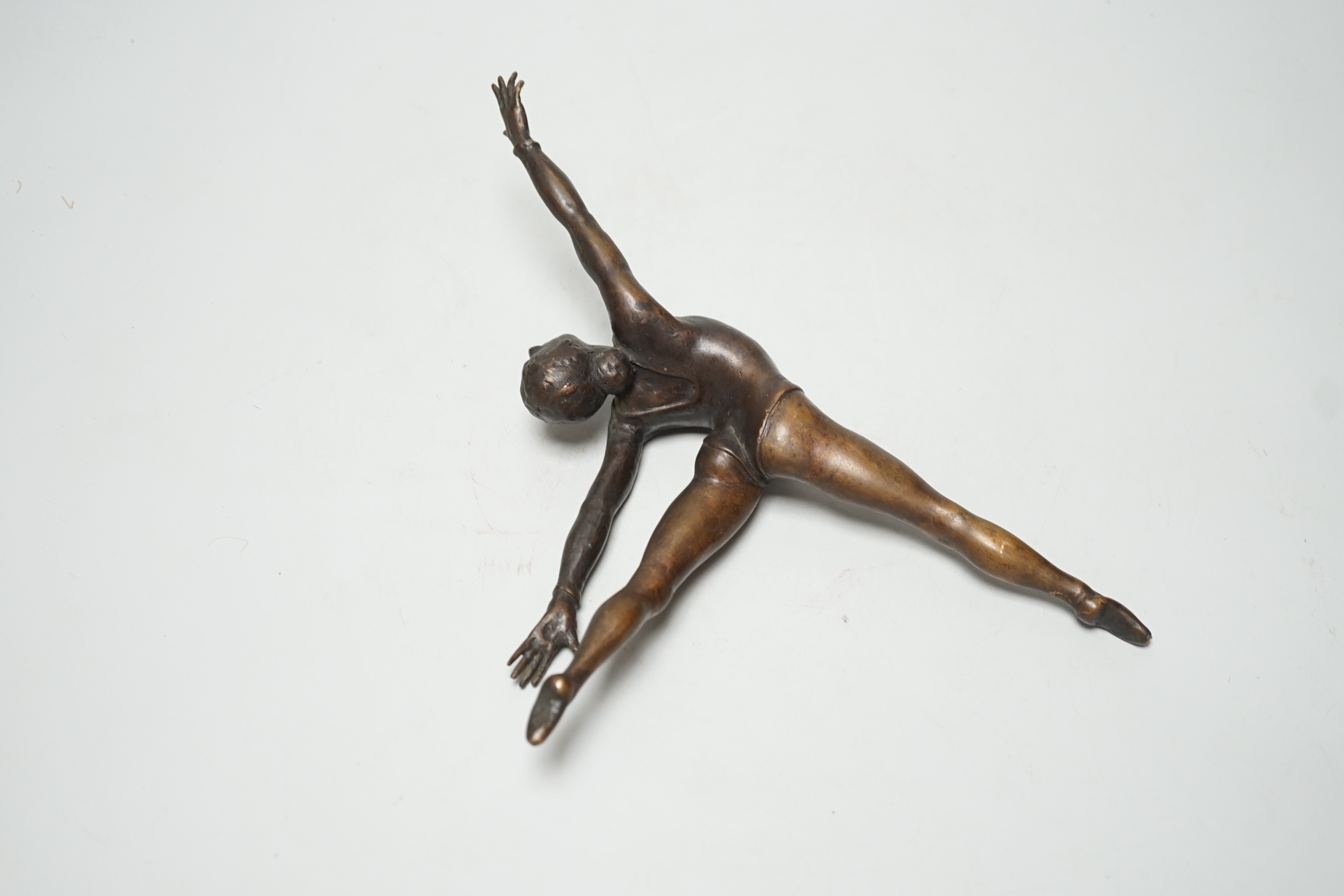 A bronze sculpture of a ballerina. 26cm wide